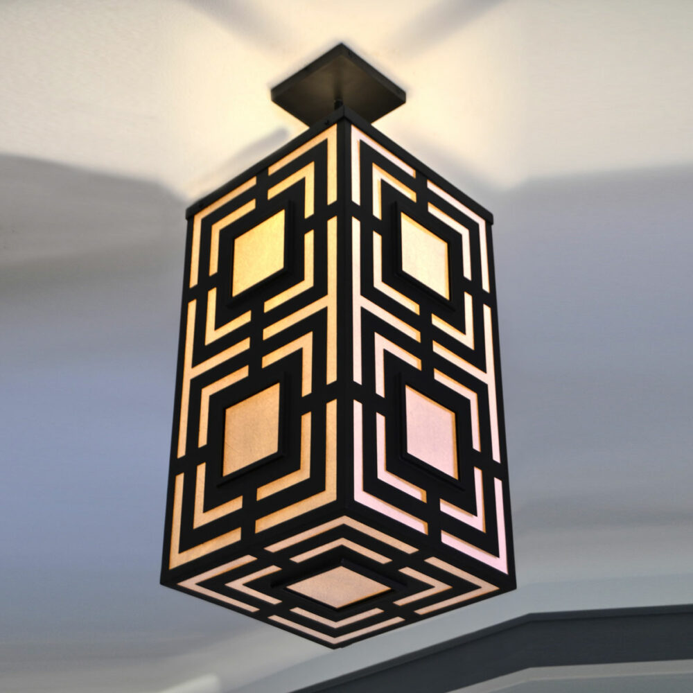 Geometric black steel pendant light: a play of graphic lines and elegant shadows