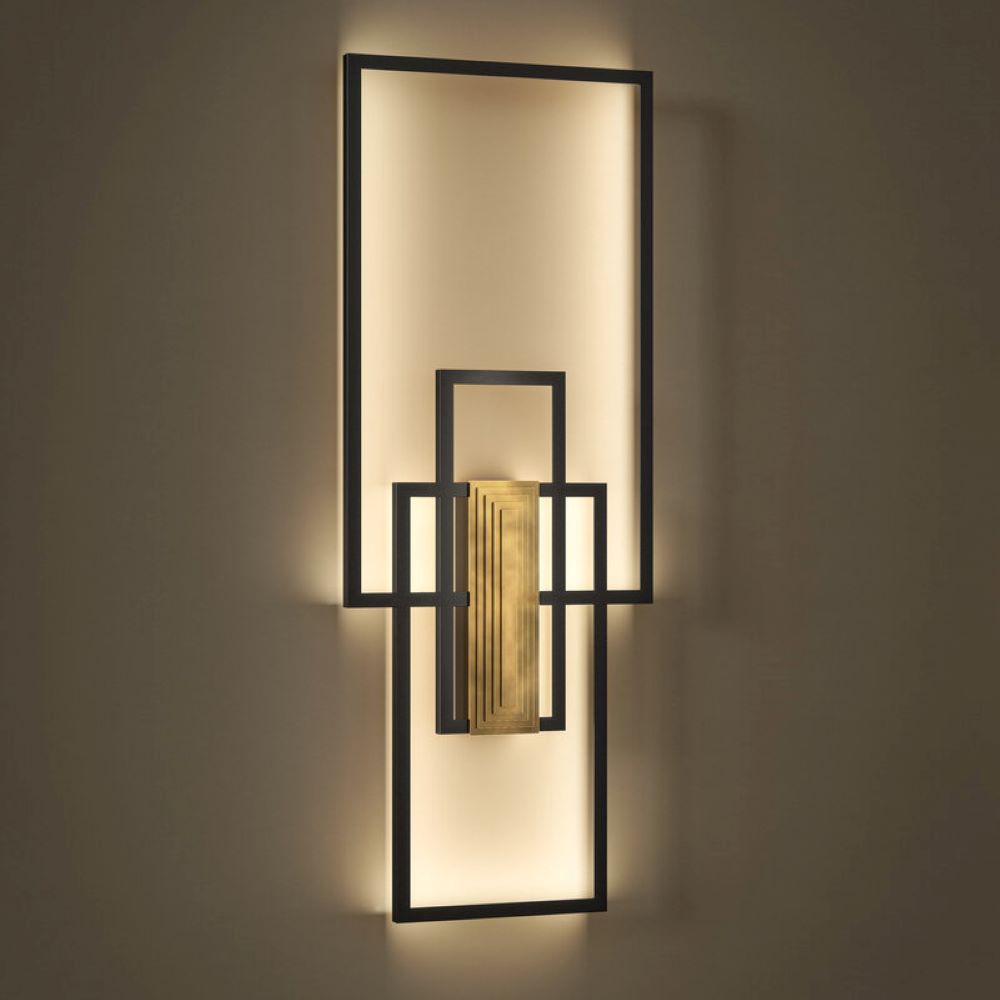 Modern geometric wall light in patinated brass and black steel. Indirect LED lighting, graphic composition. H 120 x W 45 cm.