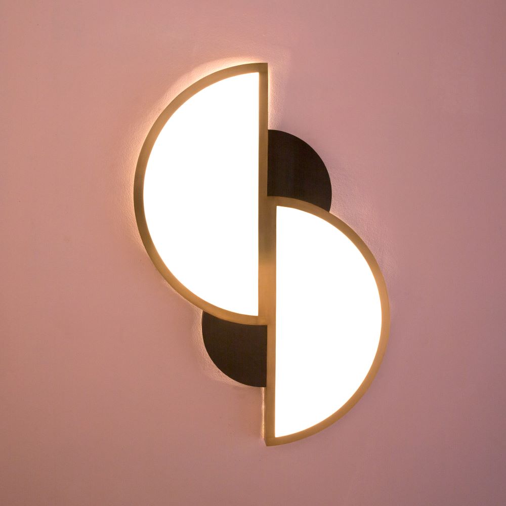 contemporary wall light fixture in patinated brass and frosted glass. Geometric design, soft LED lighting, handcrafted with elegant Art Deco influence.