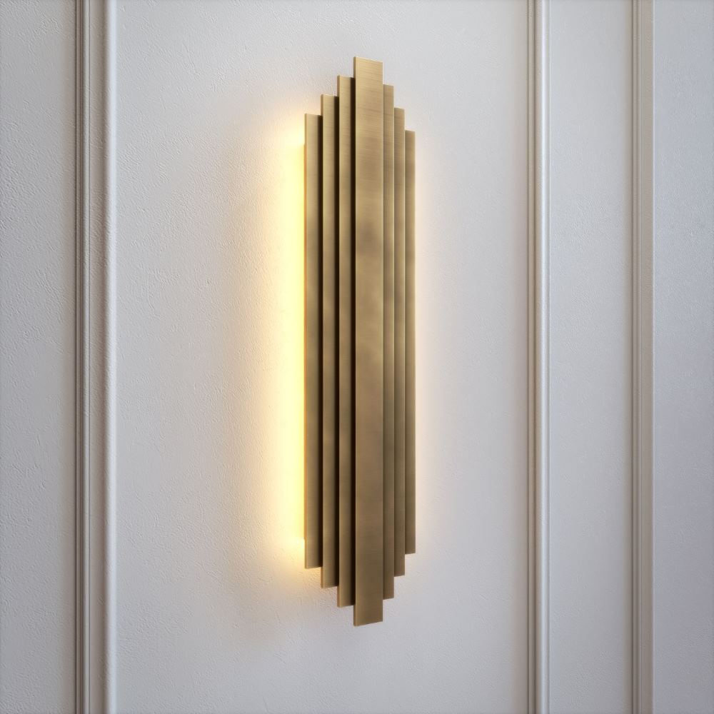 Art deco brass wall light fixture with stepped silhouette. Handcrafted in patinated brass, soft LED glow, 70 cm tall. Elegant and architectural design.