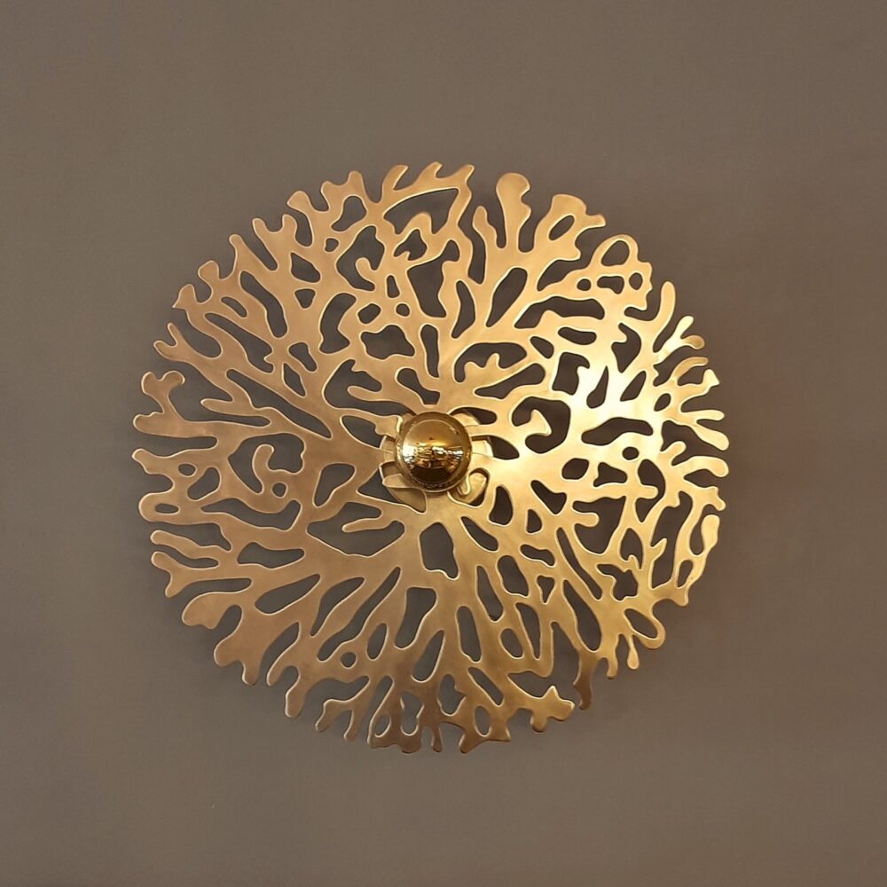 Gold wall sconce light fixture with coral-inspired silhouette. Hand-chiseled brass, soft side lighting, available in 3 sizes. Warm, elegant ambiance.