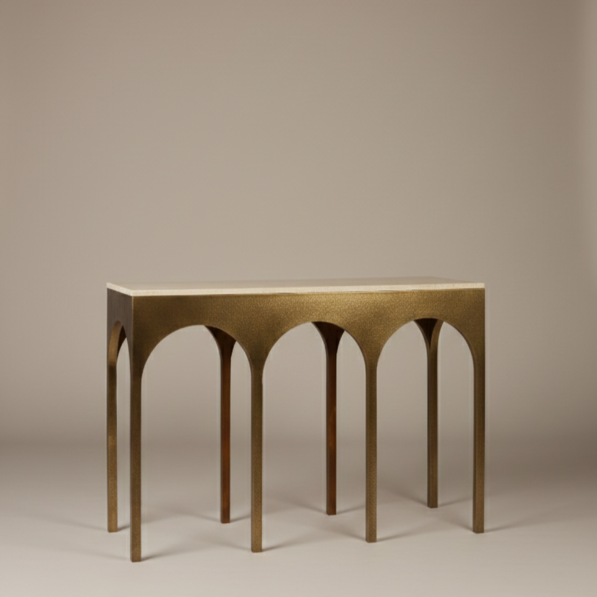 Handcrafted travertine and brass console with architectural arches and hammered brass base