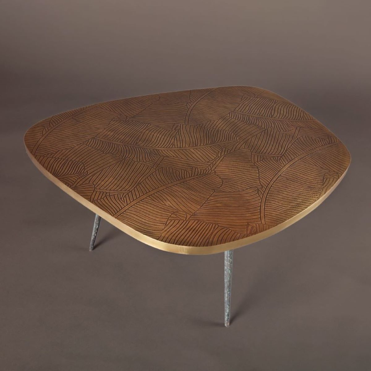 Side table with engraved brass top and brass foundry feet
