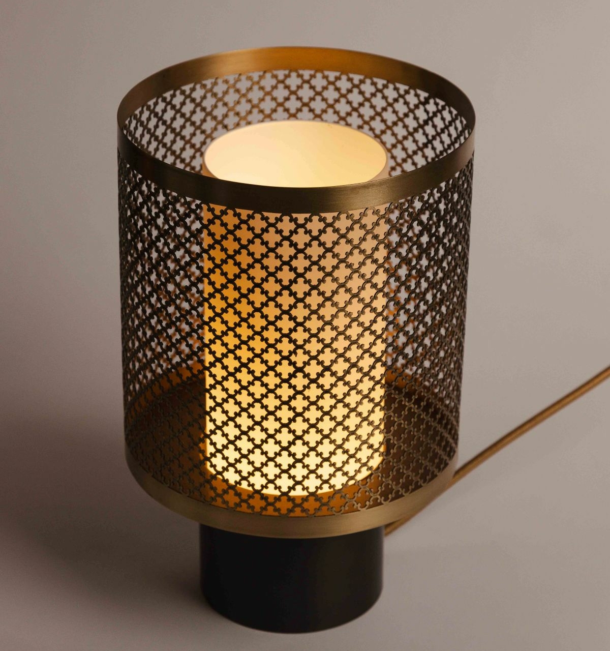 Lamp base in aged gold engraved brass and gunmetal patinated brass, opaque glass