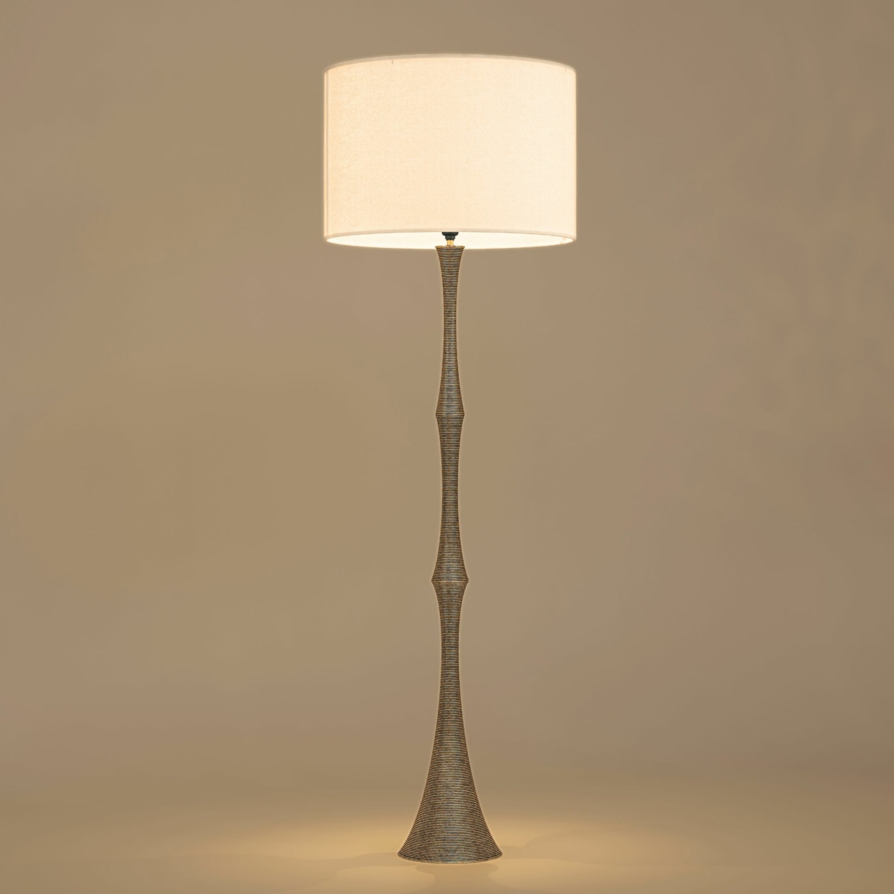 Handcrafted brass wire floor lamp with sculpted wire stem and drum polyphane fabric shade